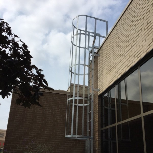 Fixed access ladder with safety cage