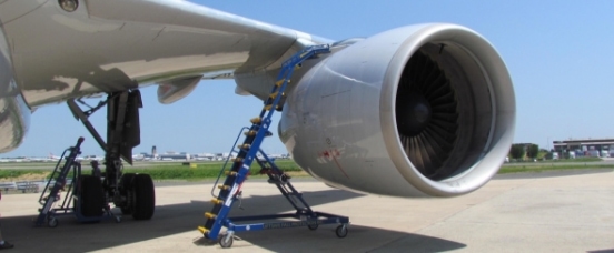 Engine Access Stand on tarmac positioned above engine cowling