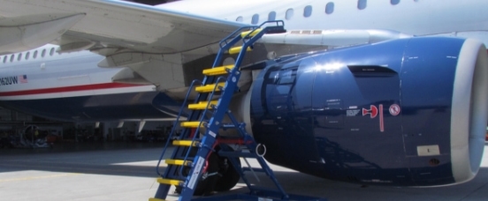 Engine Access Stand on tarmac positioned above engine cowling