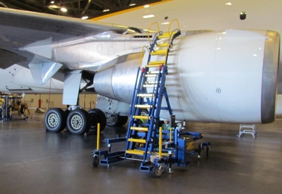 Engine access stand in hangar above cowling | aircraft maintenance