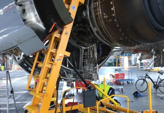 Engine access stand in use below cowling | aircraft maintenance