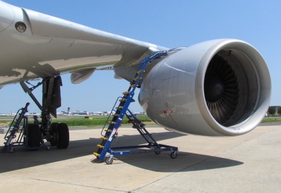 Engine access stand on tarmac above engine cowling | aircraft maintenance