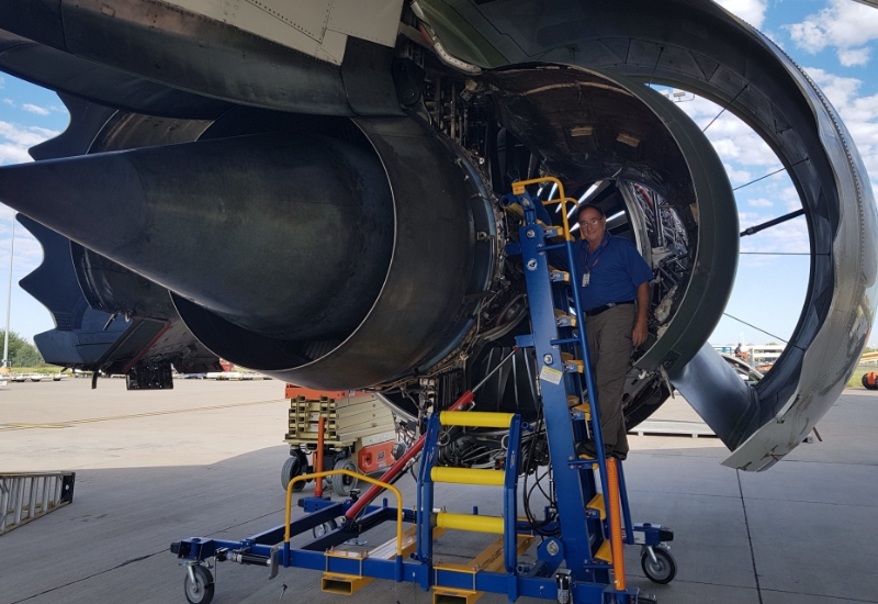 Engine access stand in use on tarmac under cowling