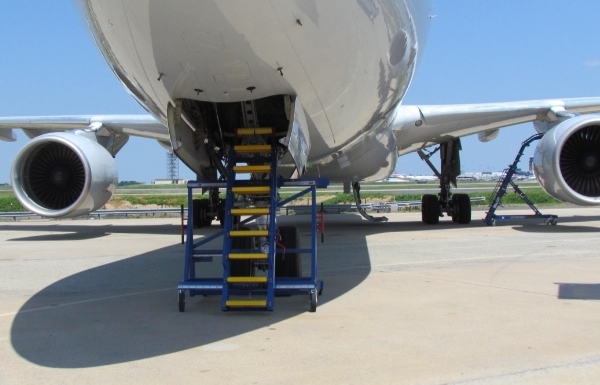 Landing gear maintenance stand in use at access hatch