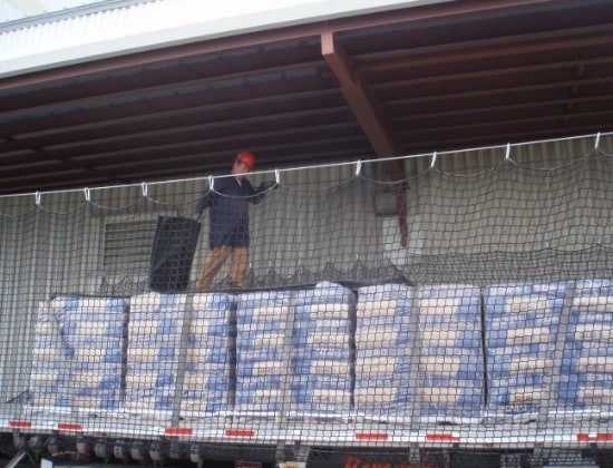 Flatbed truck netting system in use