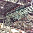 Conveyor Netting system on overhead conveyor